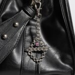Axis Charm industrial piercing chainmail charm pink variant attached to bag by silentchxos