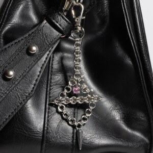 Axis Charm industrial piercing chainmail charm pink variant attached to bag by silentchxos