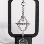 Axis Charm industrial piercing charm pink variant detail view by silentchxos