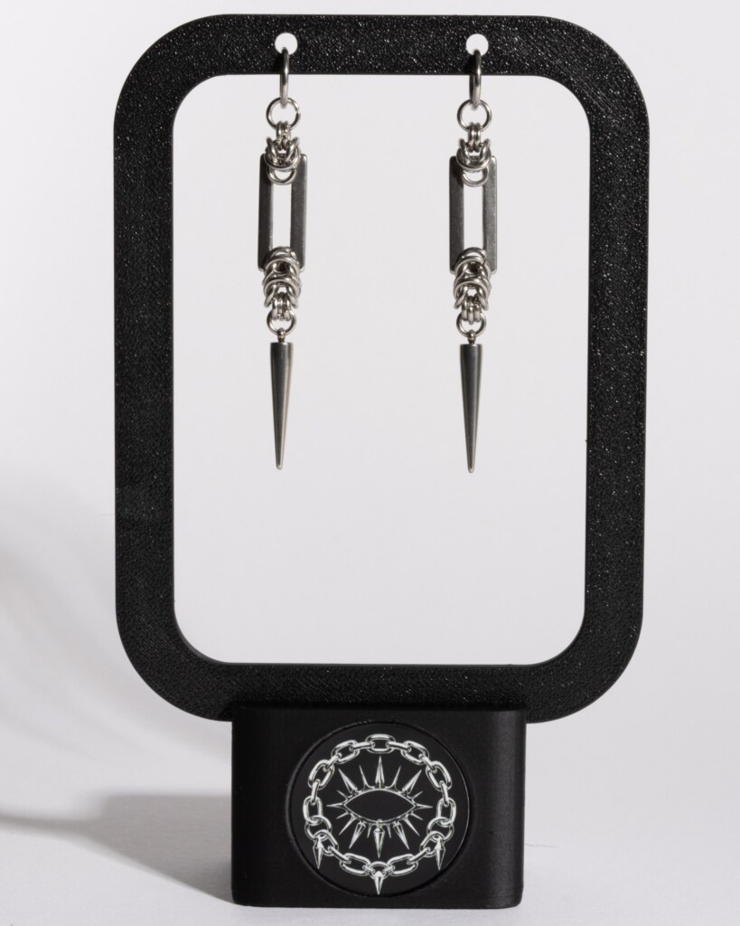 Recta Fang chainmail bar earrings displayed on earring stand by silentchxos