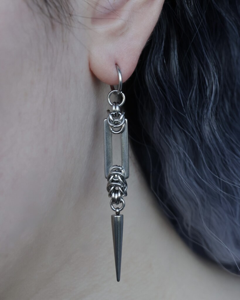 Recta Fang, spiked chainmail geometric earrings worn on an ear -close-up by silentchxos
