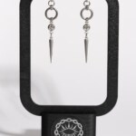 Sparkle Fang chainmail spike earrings displayed on earring stand by silentchxos