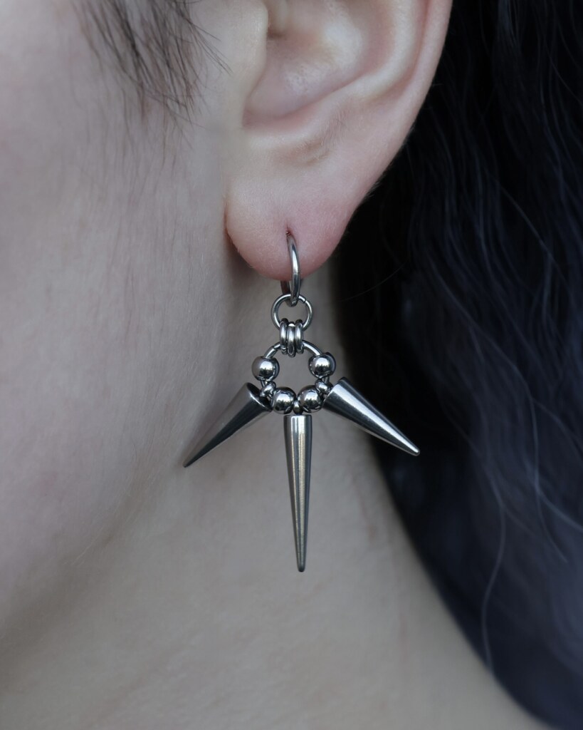 Triple Eclipse, three spiked chainmail earrings worn on an ear -close-up by silentchxos