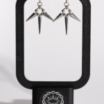 Triple Eclipse chainmail spike drop earrings displayed on earring stand by silentchxos