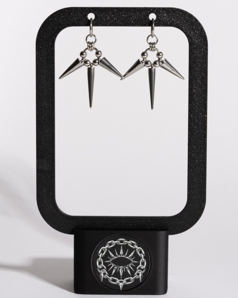 Triple Eclipse chainmail spike drop earrings displayed on earring stand by silentchxos