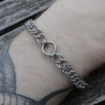 Close up shot of the Fiber handmade chainmail bracelet in stainless steel worn on the arm by silentchxos
