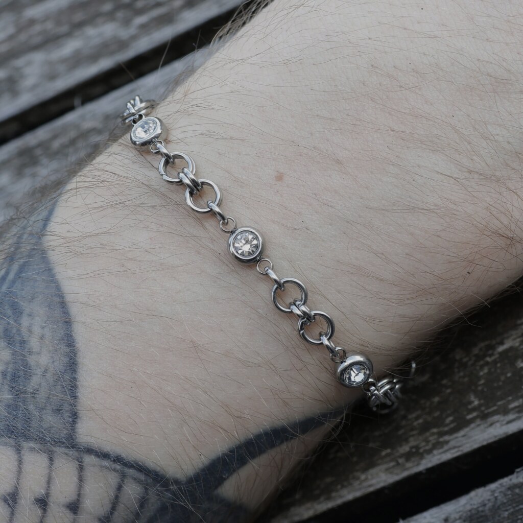 Close up shot of the Watcher handmade chainmail bracelet with Rhinestones in stainless steel worn on hand by silentchxos