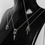 Three handmade stainless steel minimalist necklaces with fine chain and small pendants — triple spike, bead with long spike, and bead with ring — displayed against a white background.